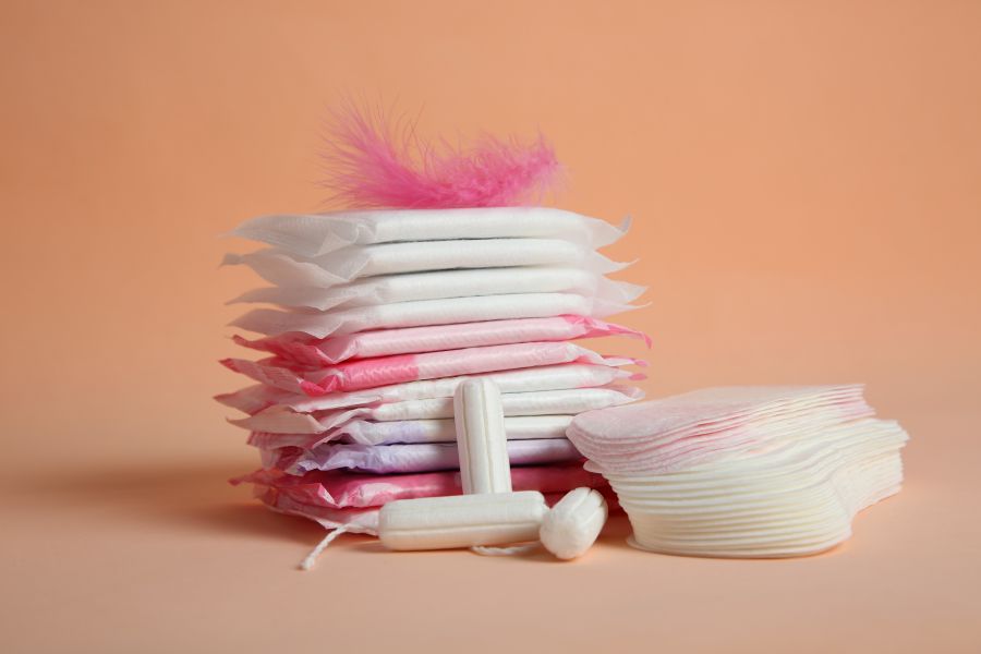pads stacked up in front of peach colored background